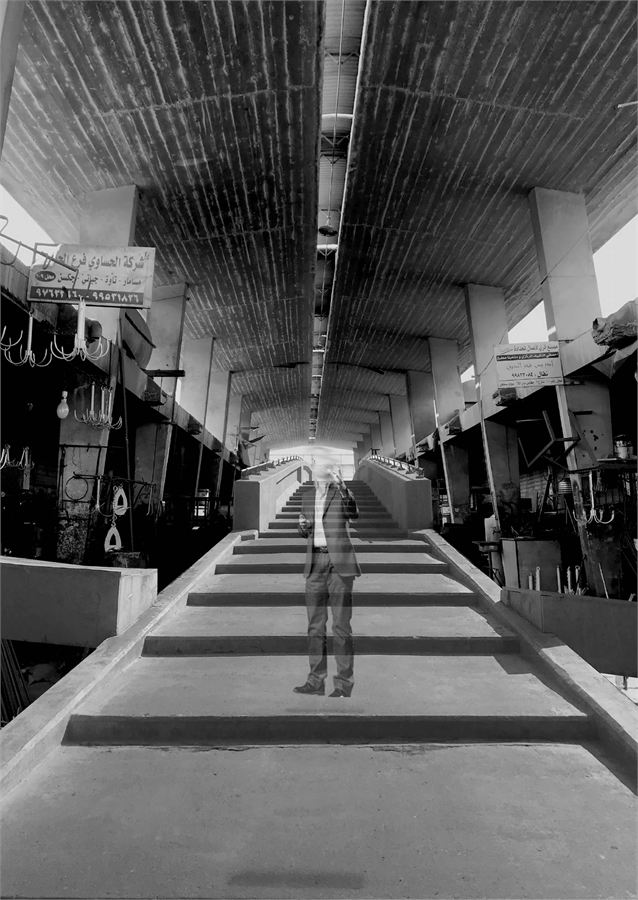 Photograph looking down a covered souq arcade in Kuwait's downtown